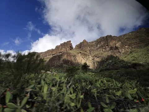 Mountain landscape with rugged cliffs and dramatic sky Stock Photos