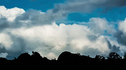 Mountain Landscape,  Running clouds and mountain silhouette of rocks and trees Stock Footage 48571515