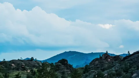 Mountain Landscape,  Running clouds and mountain silhouette of rocks and trees Stock Footage 48571566
