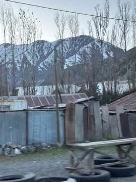 Mountain Landscape with Rustic Structures Фото