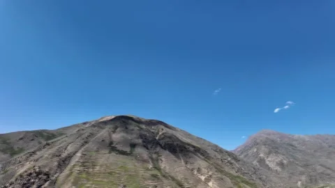 Mountain Landscape Scenic Roadside View with Mountains, Soft Clouds, and Cle Stock Footage 286334079