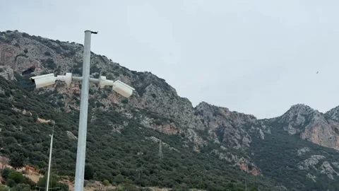 Mountain landscape with security camera and cloudy sky, blend of nature and.. Stock Footage 336398643