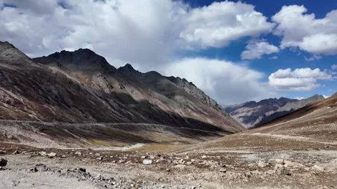 Mountain Landscape Side View Rocky Peaks, Cinematic Clouds, and Dramatic Lig Video stock 288003660