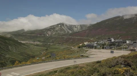 Mountain landscape with ski resort in background with snow and clouds Stock Footage 52128633