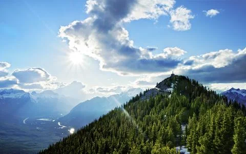 Mountain Landscape with Sun Rays, Alpine Forest and Dramatic Sky Stock Photos