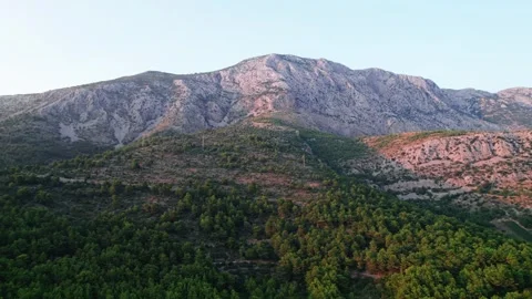 Mountain Landscape Surrounded by Lush Greenery at Dusk, Captivating the Eye Stock Footage 320799626