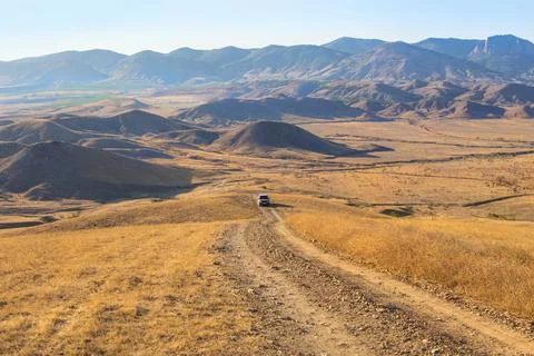 Mountain landscape with an SUV Stock Photos