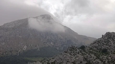 Mountain landscape with swirling clouds. Accelerated video. in the suburbs of Stock Footage 76518433