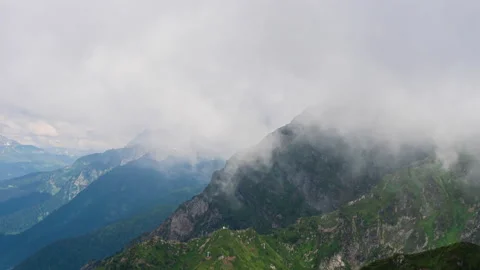 Mountain landscape. Timelapse of moving clouds in mountain tops Stock Footage 161070660