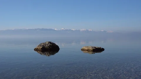 Mountain landscape with two rocks in lake, Ohrid, Macedonia Stock Footage 85570321