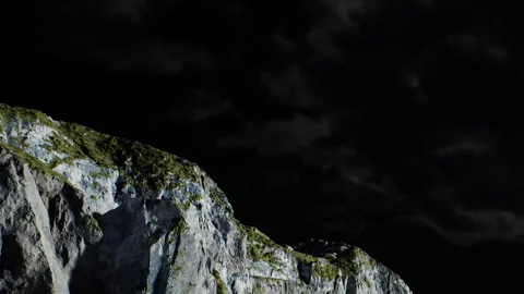 Mountain landscape under dark sky with cloudy background at night Stock Footage 339502813