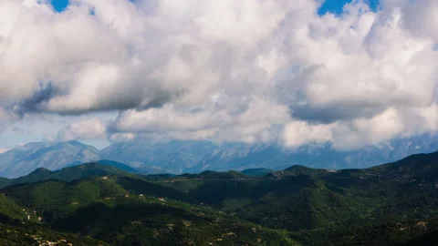 Mountain Landscape Under Dramatic Cloud Formations – 4K 30fps Stock Footage 322211548