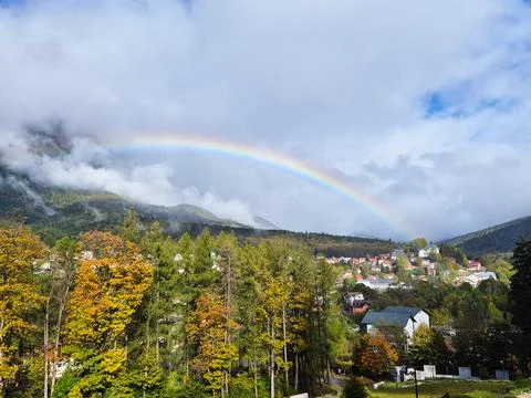 Mountain Landscape with Vibrant Rainbow Stock Photos