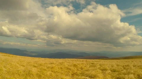 Mountain landscape view of the clouds and the hills in the distance, dry grass Stock Footage 37559545