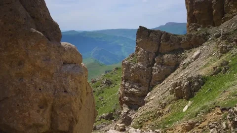 Mountain Landscape View Through Rocky Cliffs in Summer Stock Footage 325682735