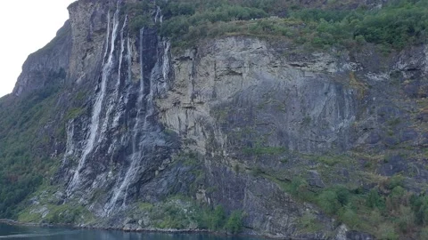 Mountain landscape. Waterfall. Beautiful view of the mountain range above the Stock Footage 169698236