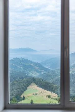 Mountain landscape in the window. Stock Photos