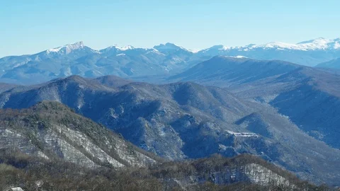 Mountain landscape on a winter day, view of a snowy forest from a height Stock Footage 116787194