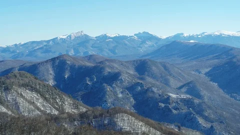 Mountain landscape on a winter day, view of a snowy forest from a height Stock Footage 116787712