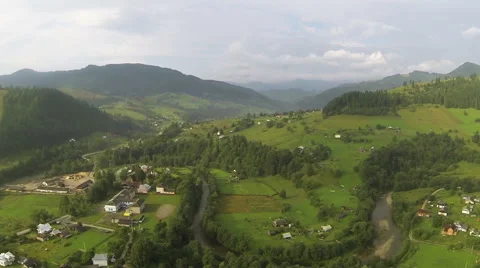 Mountain landscape withe village and  wood. Aerial  shot  Stock Footage 42856303