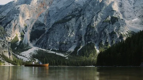 Mountain Landscape. Young Couple In A Boat On A Lake. 스톡 동영상 107421453