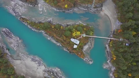 Mountain landscapes overlooking a mountain river with bridge and Island 스톡 동영상 220034716