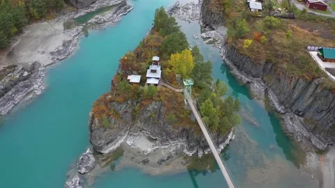 Mountain landscapes overlooking a mountain river with bridge and Island Stock Footage 220034719