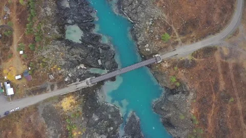 Mountain landscapes overlooking a mountain river with bridge Stock Footage 220034722