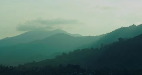 Mountain Layers and Forested Hills in Soft Morning Light Stock Footage 336948309