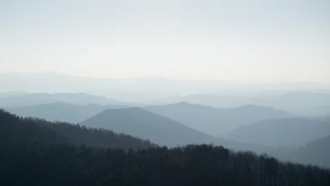 Mountain layers in haze Stock Photos