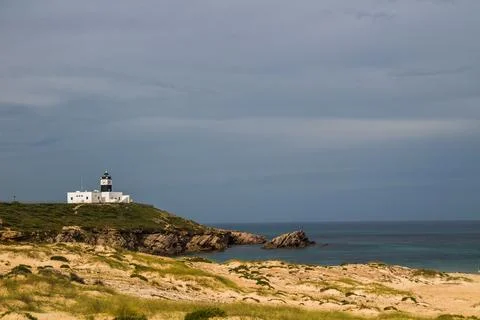 A Mountain Lighthouse Next to a Beach at Cap Angela, Bizerte, Tunisia Stock Photos