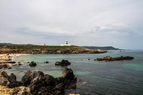 A Mountain Lighthouse Next to a Beach at Cap Angela, Bizerte, Tunisia Stock Photos