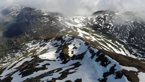 Mountain located in Norway in the spring, filled with both grass and snow. Video stock 108250366
