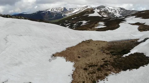 Mountain located in Norway in the spring, filled with both grass and snow. Video stock 108250604