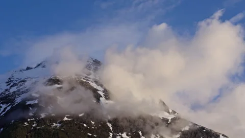 Mountain with lots of clouds over it Stock Footage 267684513