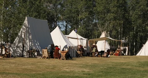 Mountain Man Rendezvous primitive camp family 4K Stock Footage 115429936