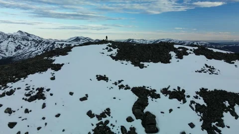 Mountain Man standing on the Summit, Panning Aerial View Stock Footage 289565812