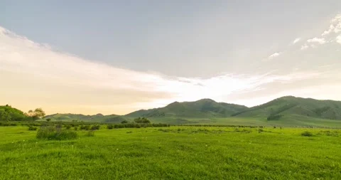 Mountain meadow time-lapse at the summer or autumn sunrise time. Wild nature and Stock Footage 169661914