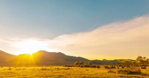Mountain meadow time-lapse at the summer or autumn sunset time. Wild nature and Stock Footage 169662162