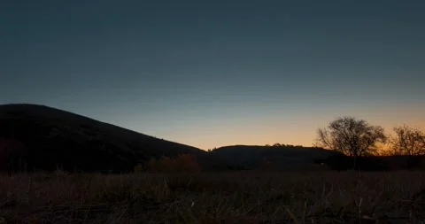 Mountain meadow time-lapse at the summer or autumn sunrise time. Wild nature and Stock Footage 201319784