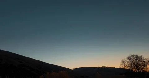Mountain meadow time-lapse at the summer or autumn sunrise time. Wild nature and Stock Footage 221683297