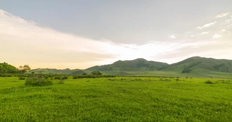 Mountain meadow time-lapse at the summer or autumn sunrise time. Wild nature and Stock Footage 310717780