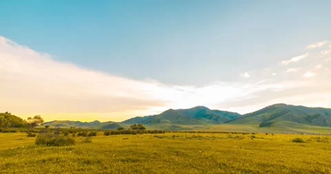 Mountain meadow time-lapse at the summer or autumn sunrise time. Wild nature and Stock Footage 310717903