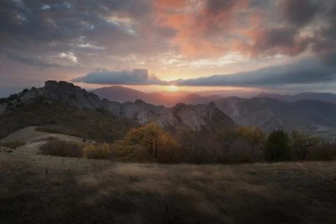 Mountain in the mist at sunset Stock Photos