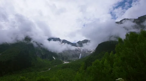 Mountain in moving clouds Stock Footage 52343030