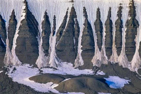 Mountain with natural pattern with snow groove on the mountainside in Arctic Stock Photos