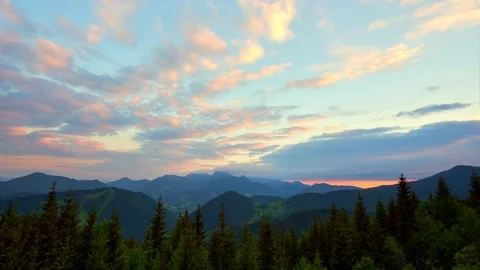 Mountain nature in spring. Clouds and landscape are colored in rich colors at Stock Footage 198227783