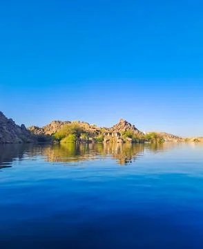 Mountain near Philae temple complex is an Agilkia island. Temple Arsenophis. Stock Photos