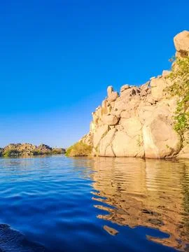 Mountain near Philae temple complex is an Agilkia island. Temple Arsenophis. Stock Photos
