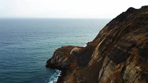 Mountain into the Ocean from a Drone Stock Footage 155772584